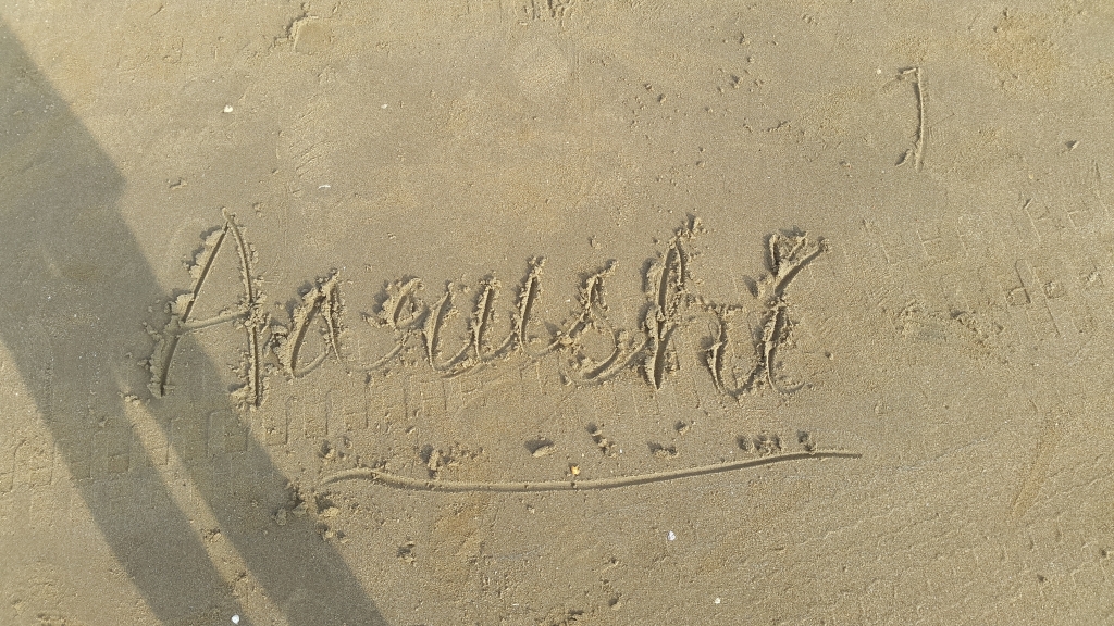 Writing name on sand